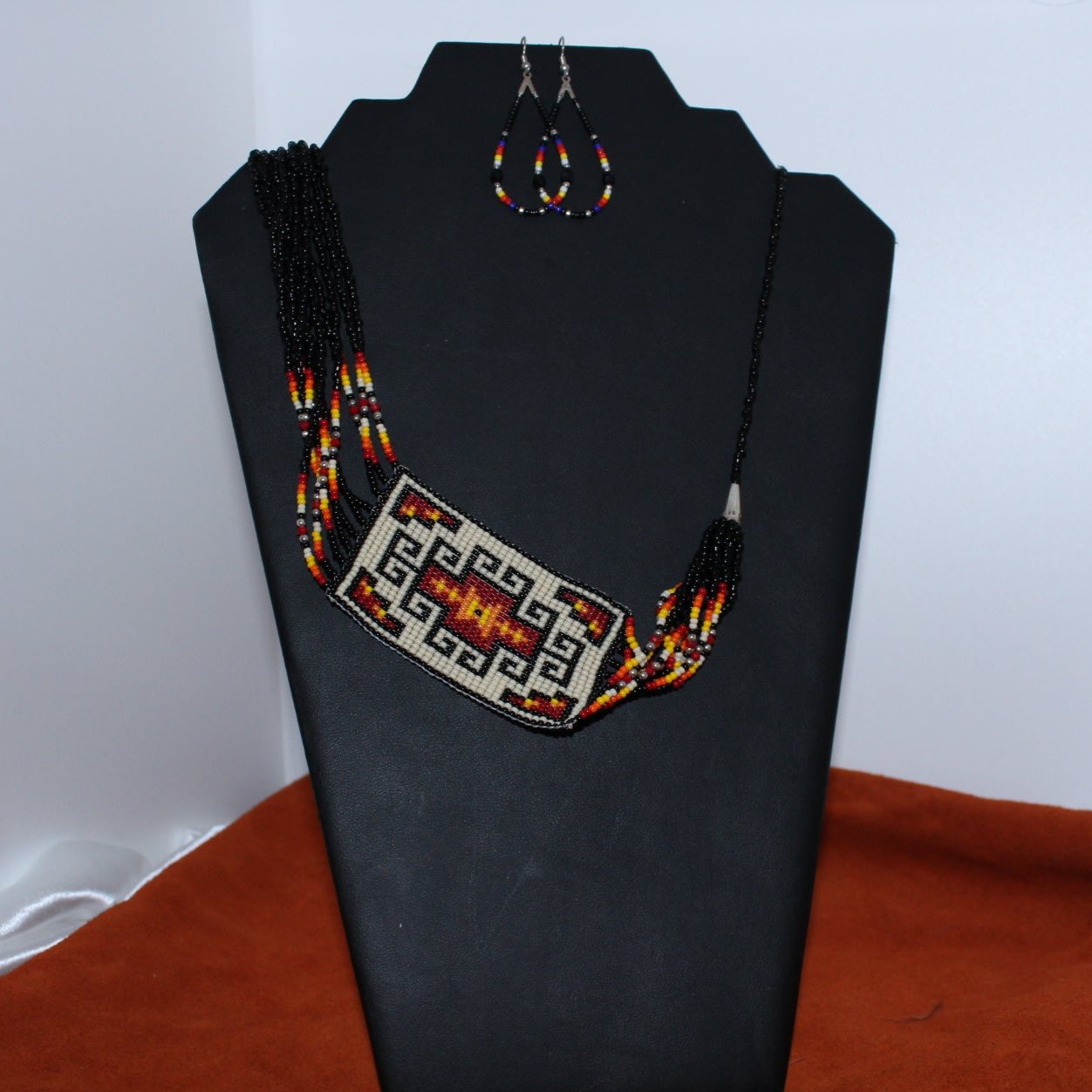 Beautiful Necklace and earrings Black,White,Red, Orange,and red. Very colorful Navajo style .