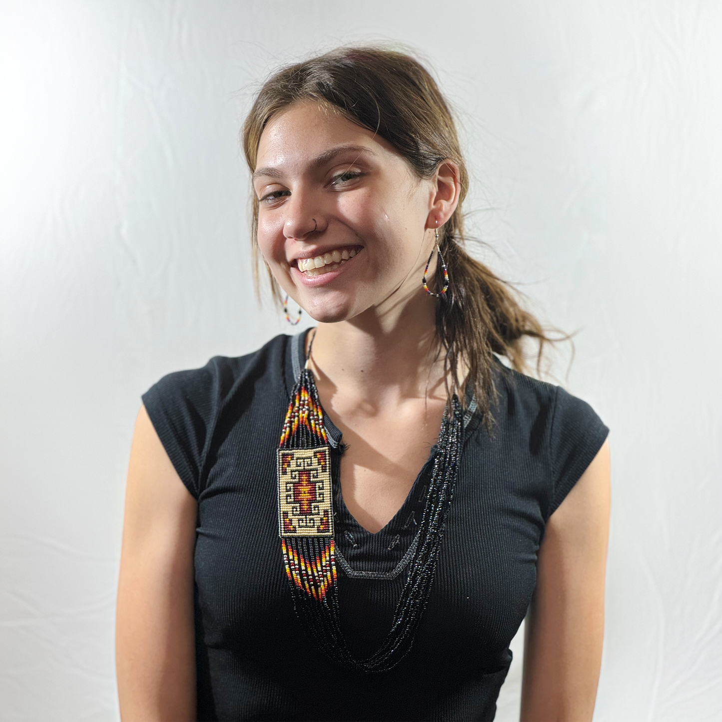 Beautiful Necklace and earrings Black,White,Red, Orange,and red. Very colorful Navajo style .