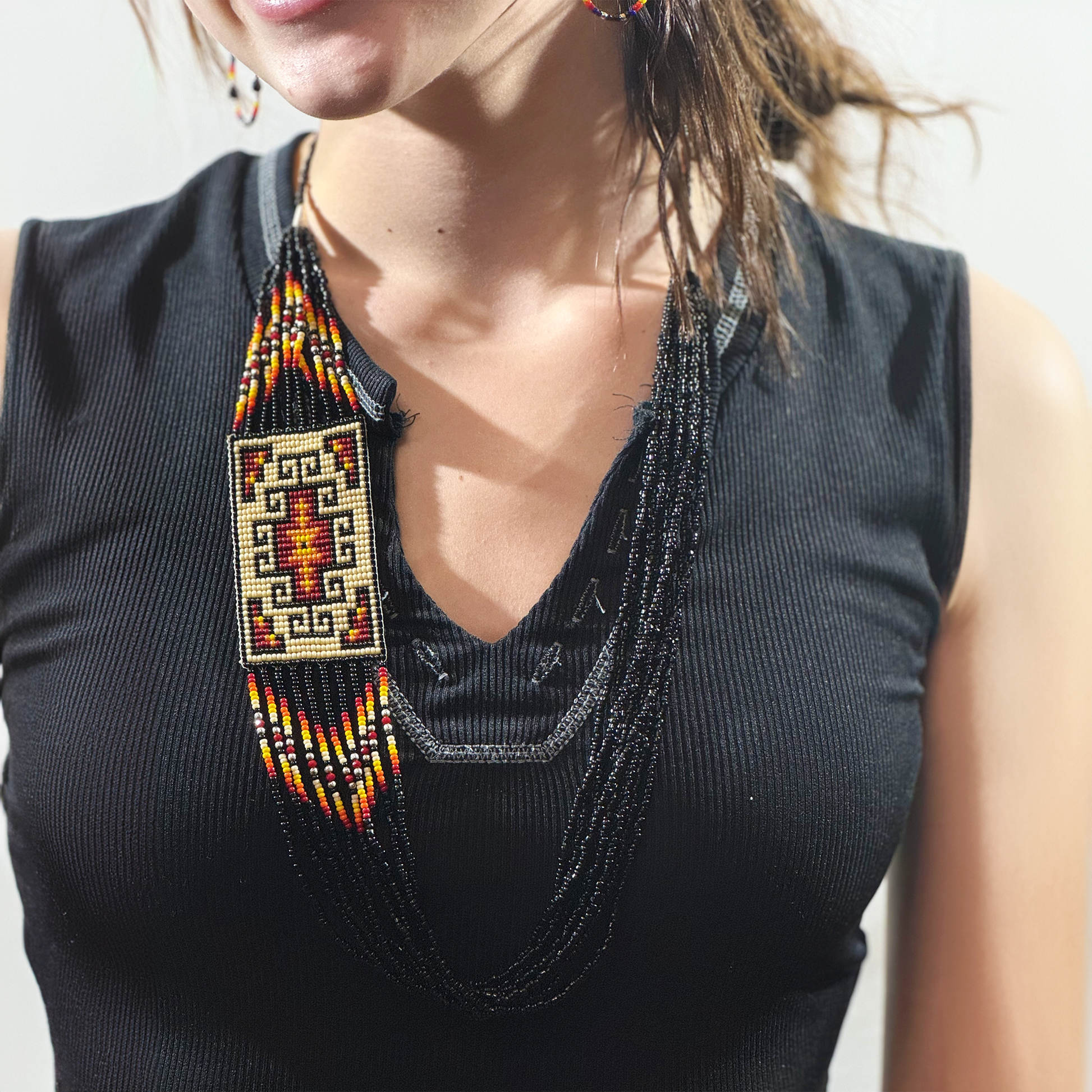 Beautiful Necklace and earrings Black,White,Red, Orange,and red. Very colorful Navajo style .